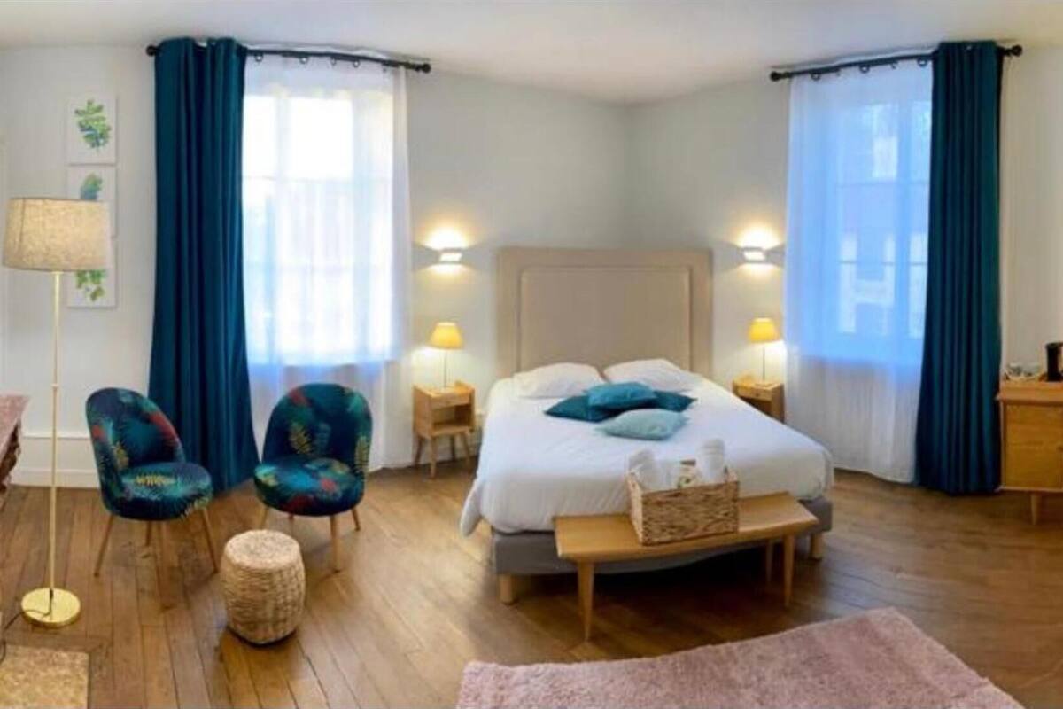 desk, laptop workspace, bed sheets