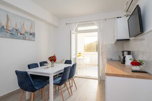 Apartamento (Apartments Azzurro- Three Bedroom Apa) | Sala de jantar