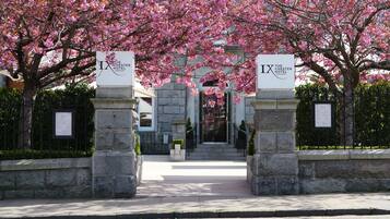The entrance to The Chester Hotel Aberdeen, featuring stone pillars and a pathway leading to the entrance.
