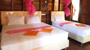 Two beds with white linens and pink mosquito nets, wooden walls, and a window with sunlight. - Lanta Maikeaw Bungalow (Ko Lanta)