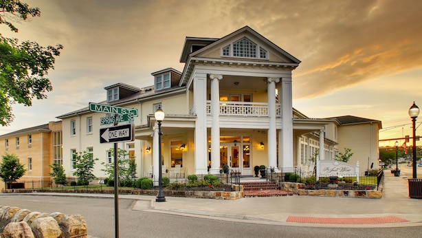 A historic building with a prominent entrance, columns, and a balcony. - The Inn at Wise (Wise)