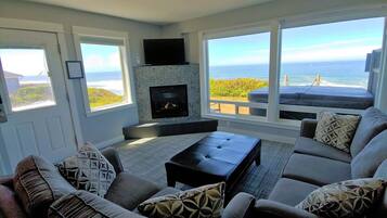 Deluxe Suite, 2 Bedrooms, Hot Tub, Oceanfront (Access via Stairs) | Living area | 20-inch flat-screen TV with cable channels, TV, fireplace