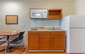 A compact kitchen with a microwave, sink, and refrigerator. - Extended Stay America Select Suites - Atlanta - Chamblee (Chamblee)