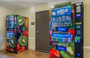 Two vending machines in a hallway, one labeled 'SNACKS' and the other 'DRINKS'. - Extended Stay America Select Suites - Atlanta - Chamblee (Chamblee)