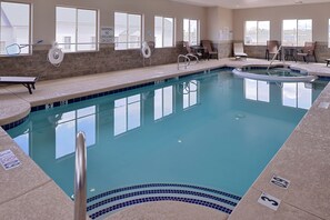 An indoor swimming pool with clear water, multiple lanes, and safety signs. - Holiday Inn Express & Suites Williams by IHG (Williams)