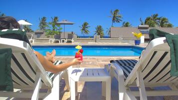 Outdoor pool, open 7:00 AM to 7:00 PM, sun loungers