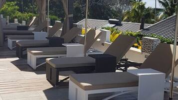 Outdoor pool, open 7:00 AM to 7:00 PM, sun loungers