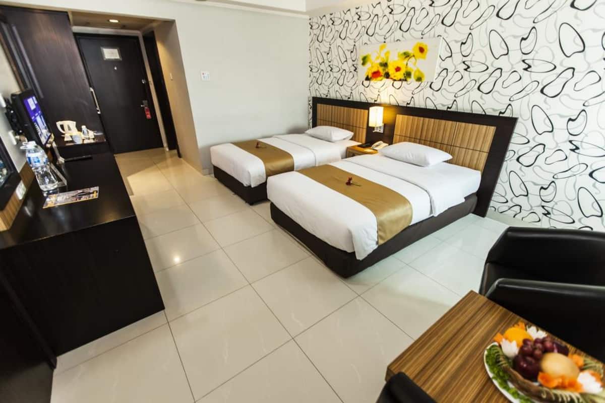 Luxe beddengoed, een minibar, een kluis op de kamer, een bureau