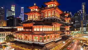 A traditional multi-story building with a distinct architectural style, surrounded by modern high-rise buildings. - CUBE Family Boutique Capsule Hotel (Singapore)