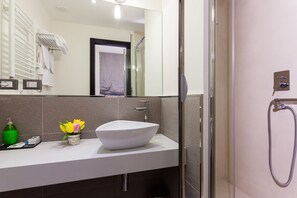 Shower, free toiletries, hair dryer, towels
