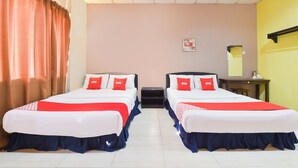 A hotel room with two beds, each with red and white bedding, a small table, and a mirror on the wall. - Hotel O Destiny Riverside Hotel (Kota Bharu)