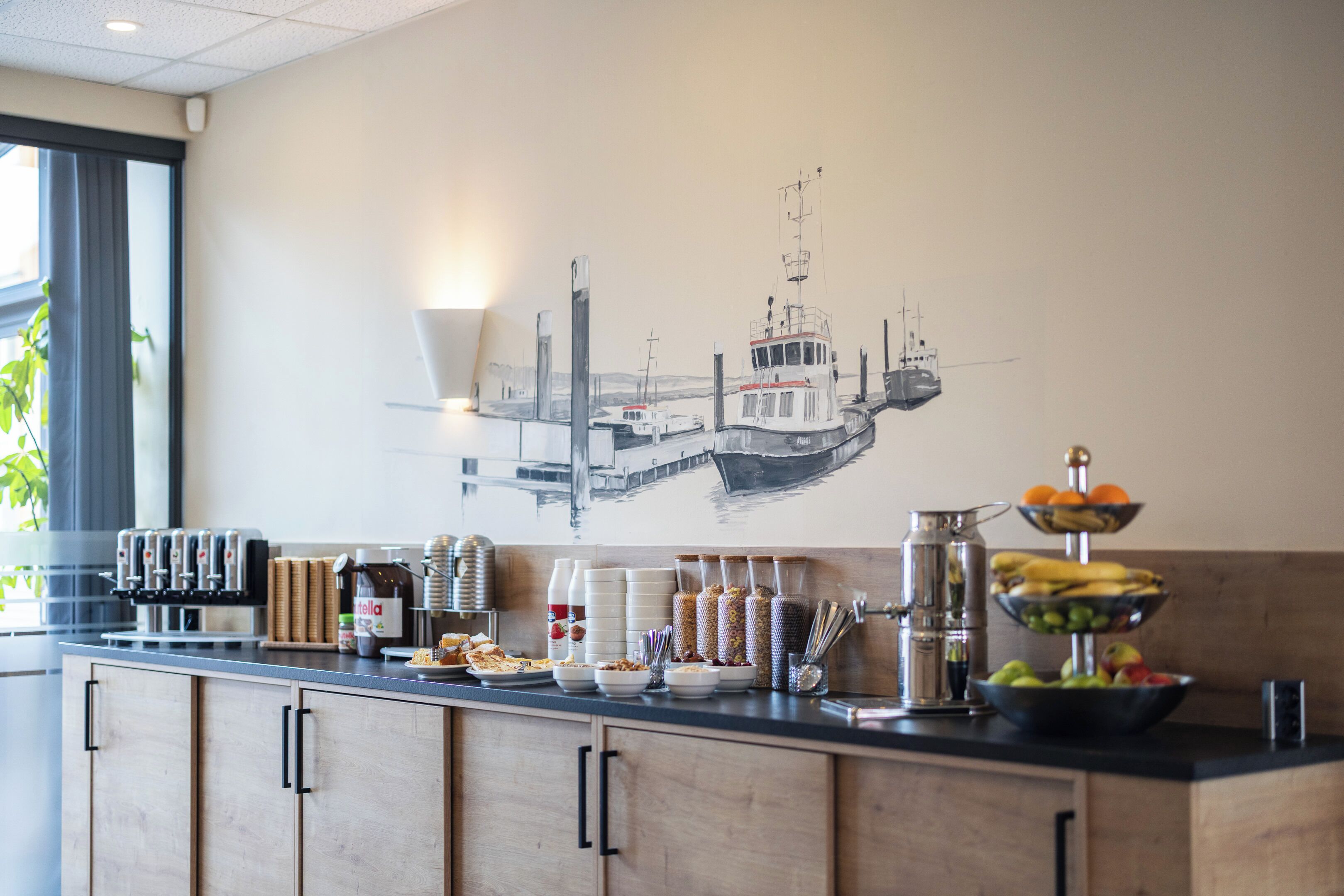 A breakfast buffet with various food items and condiments.