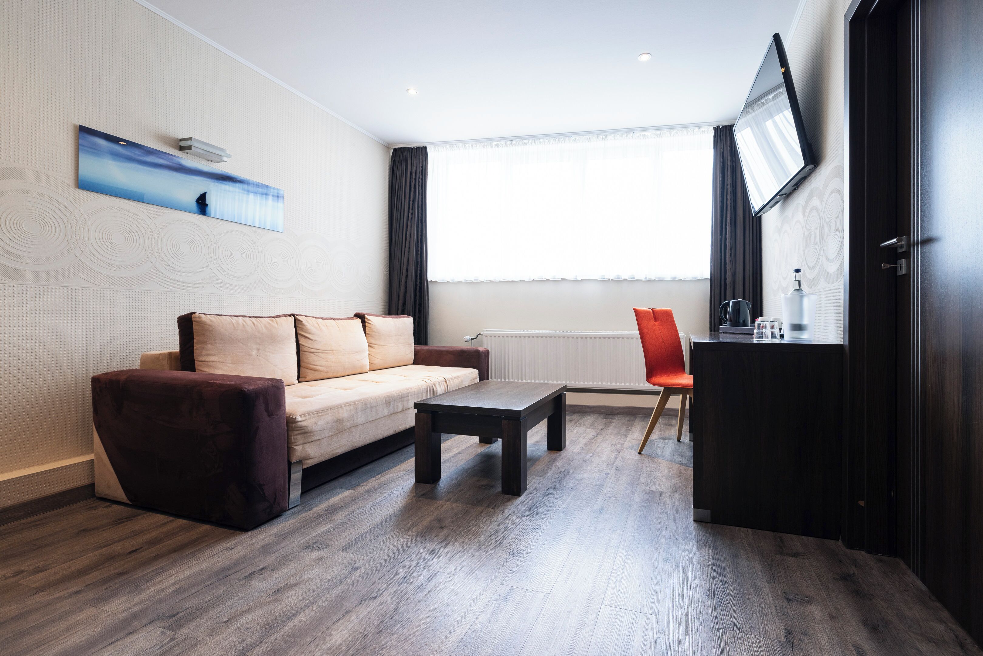 junior suite, 1 bedroom, bathtub, courtyard area | living area | 32-inch flat-screen tv with satellite channels, tv