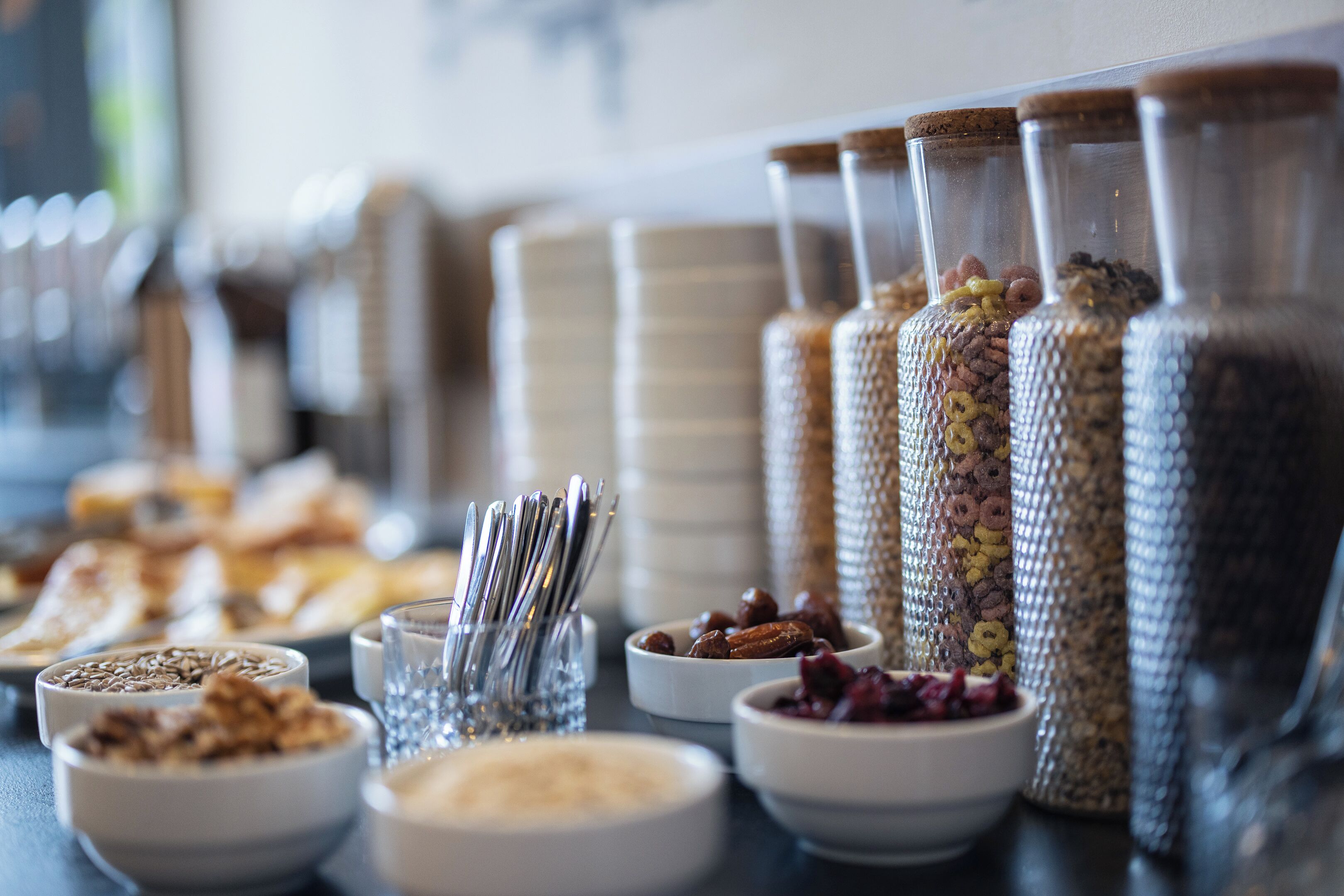 A buffet table with various food items and containers.