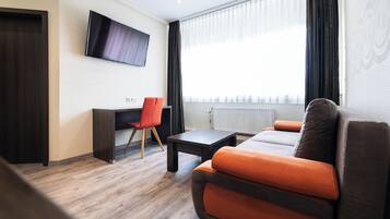 Junior Suite, 1 Bedroom, Courtyard Area | Living area | 32-inch flat-screen TV with satellite channels, TV