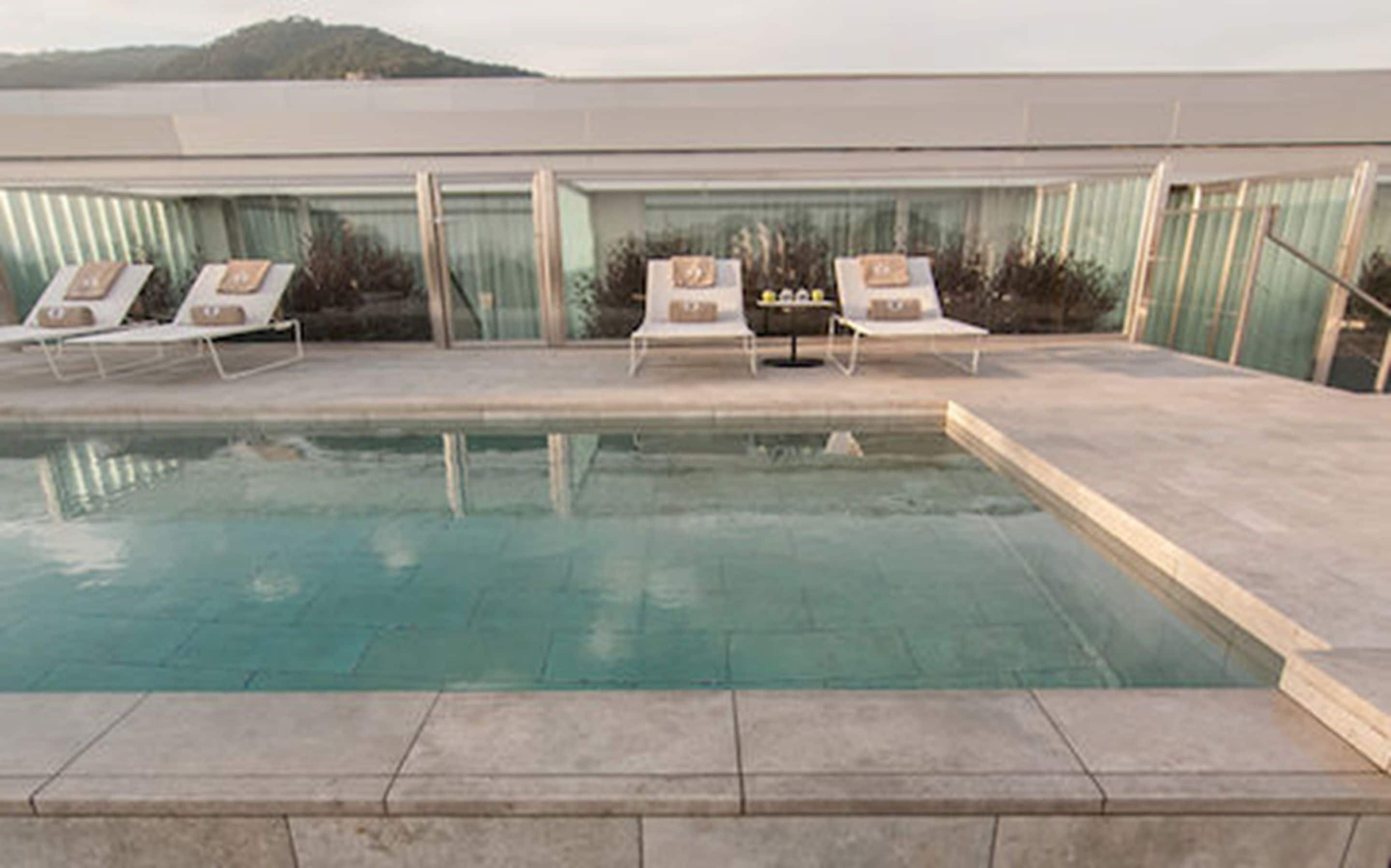 outdoor pool, pool umbrellas, pool loungers