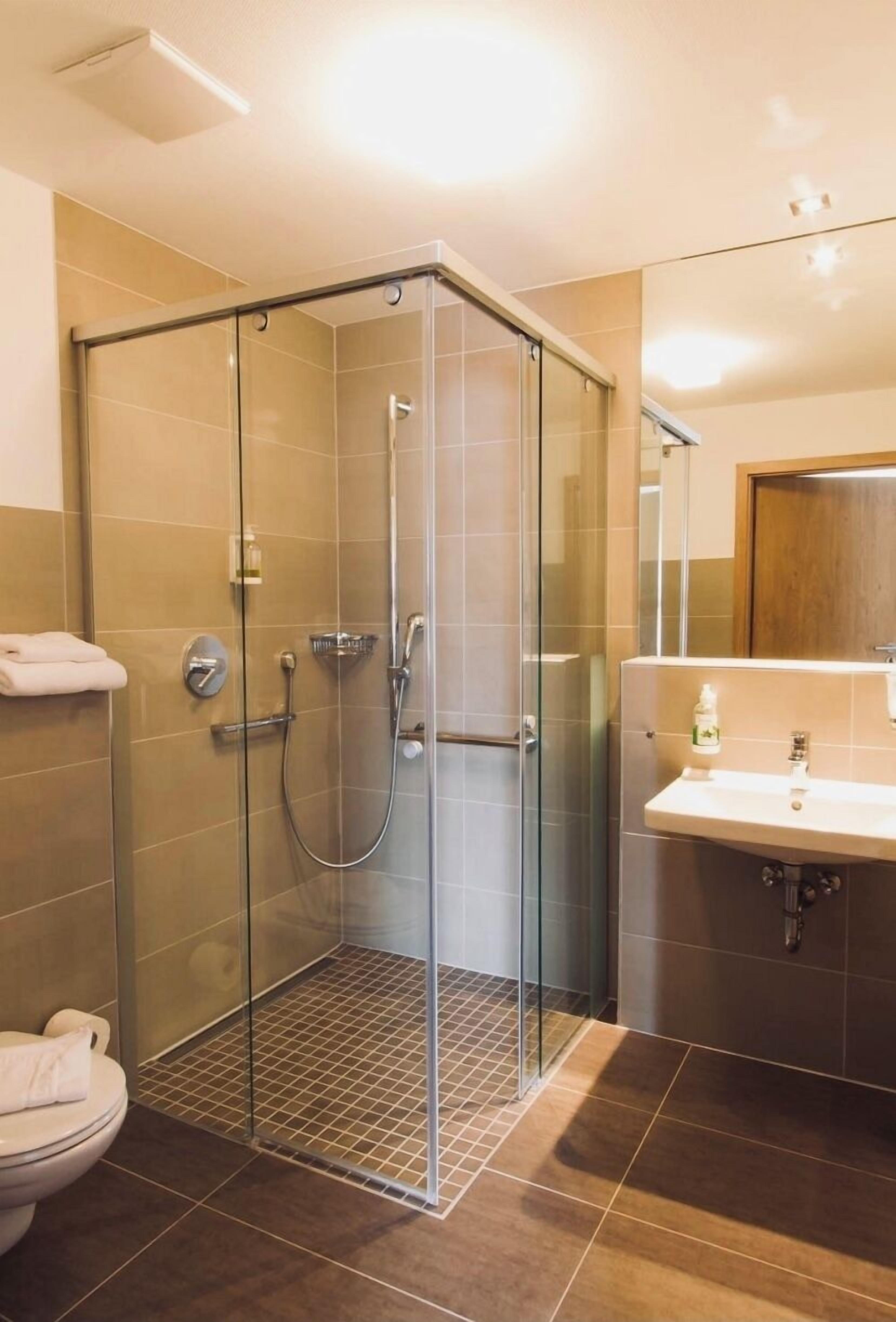 standard quadruple room | bathroom | shower, hair dryer, towels