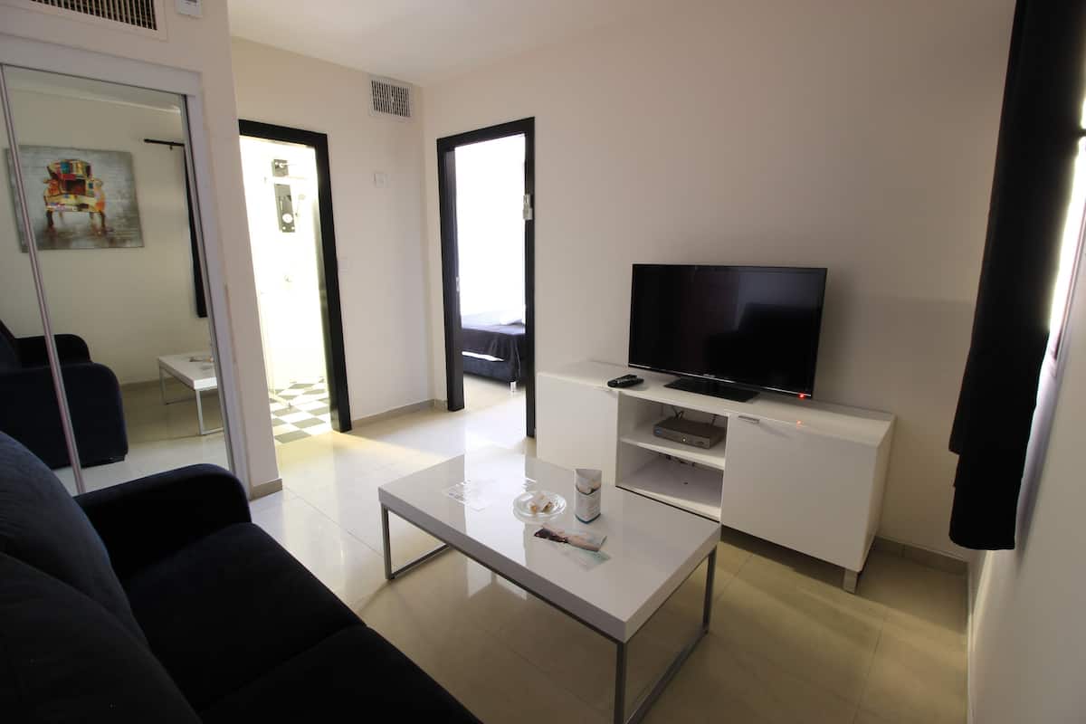 Suite Junior | Area soggiorno | TV a schermo piatto