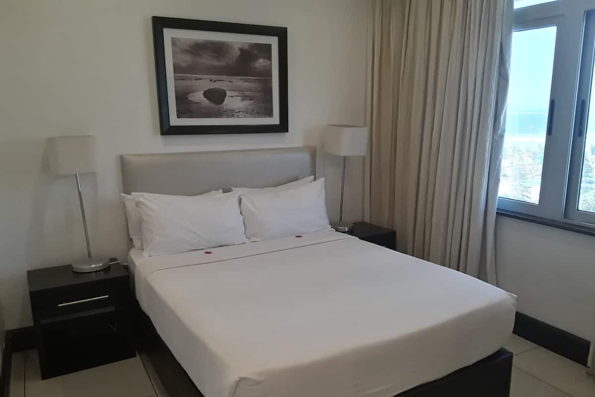 Family Room, Partial Ocean View (4 Sleeper) | In-room safe, desk, blackout drapes, free WiFi