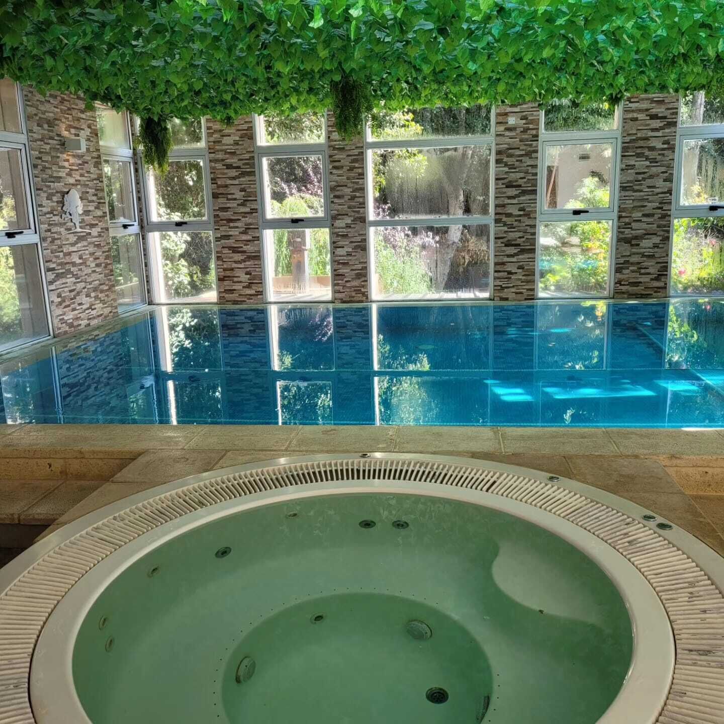 Indoor pool, open 10:00 AM to 10:00 PM, pool loungers