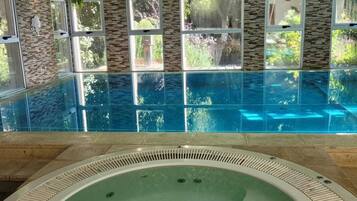 Indoor pool, open 10:00 AM to 10:00 PM, pool loungers
