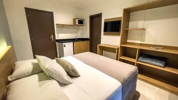 Frigobar, cortinas blackout, Wi-Fi de cortesia, roupa de cama
