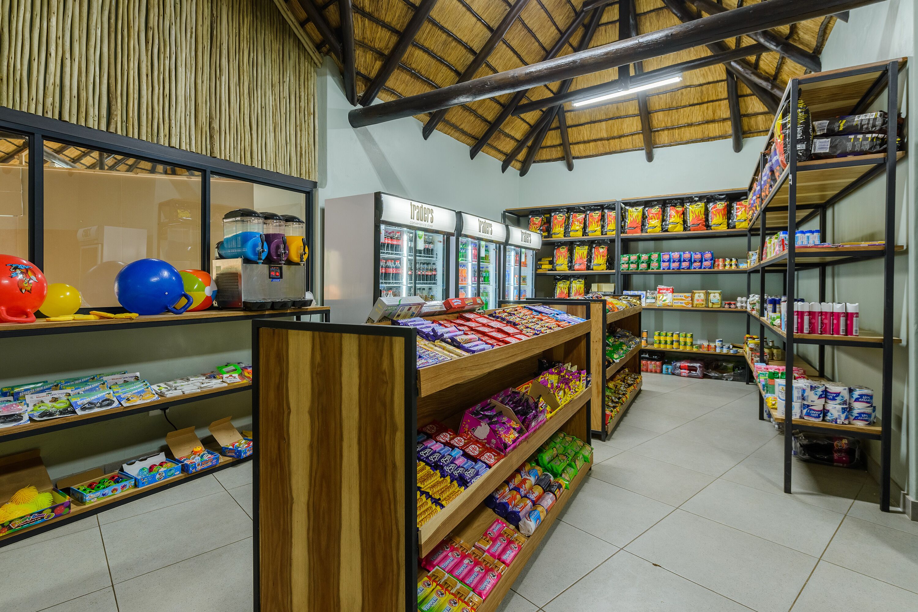 A store with shelves stocked with snacks, drinks, and other items.