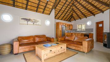 Three Bedroom Luxury Chalet with Splash Pool | Living room | Flat-screen TV
