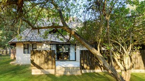 A house with a tiled roof, a front porch, and a wooden fence. - Waterberg Game Park (Vaalwater)