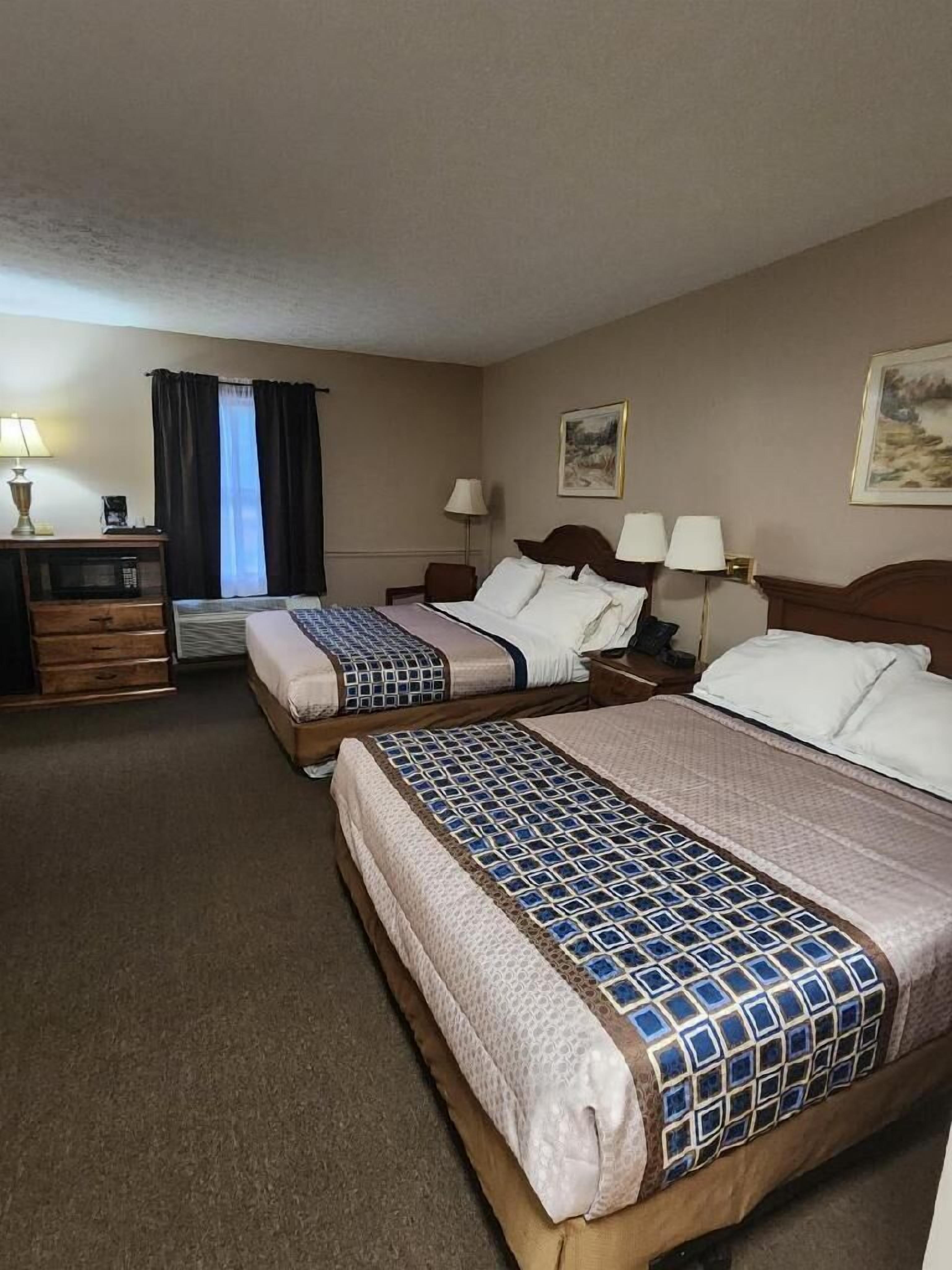 double room, 2 queen beds | premium bedding, desk, iron/ironing board, free wifi