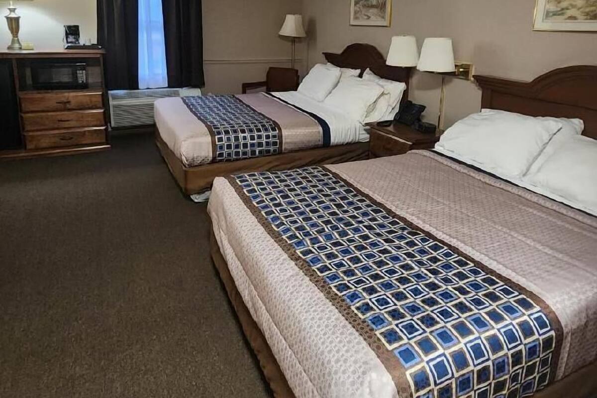 double room, 2 queen beds | premium bedding, desk, iron/ironing board, free wifi