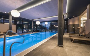 Indoor pool, open 7:00 AM to 7:00 PM, pool loungers