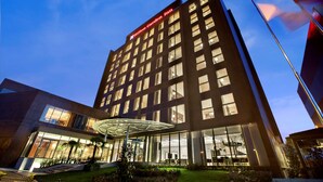 A modern hotel building with a prominent sign reading "Hilton Garden Inn." - Hilton Garden Inn Istanbul Beylikduzu (Istanbul)