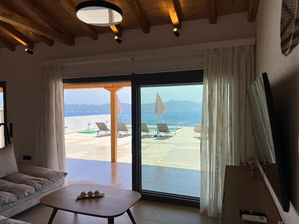 Luxury Villa, 2 Bedrooms, Sea View | Living area | 50-inch flat-screen TV with digital channels, LED TV - Four Seasons Villas (Skiathos)