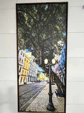 A framed street view with cobblestone pavement, a lamppost, and colorful buildings. - Pousada Praia Boa Viagem (Recife)