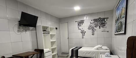 Economy Quadruple Room | Hypo-allergenic bedding, minibar, individually decorated, desk