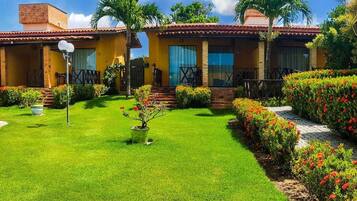 Enjoy a serene outdoor space surrounded by lush gardens and a swimming pool.