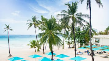 On the beach, white sand, beach towels