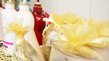 Separate tub and shower, hair dryer, slippers, towels