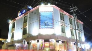 A multi-story building with a prominent sign on the top left corner. - Hotel Parco - Adults only (Kyoto)