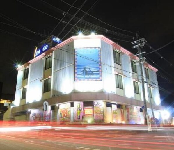 A multi-story building with a prominent sign on the top left corner. - Hotel Parco - Adults only (Kyoto)