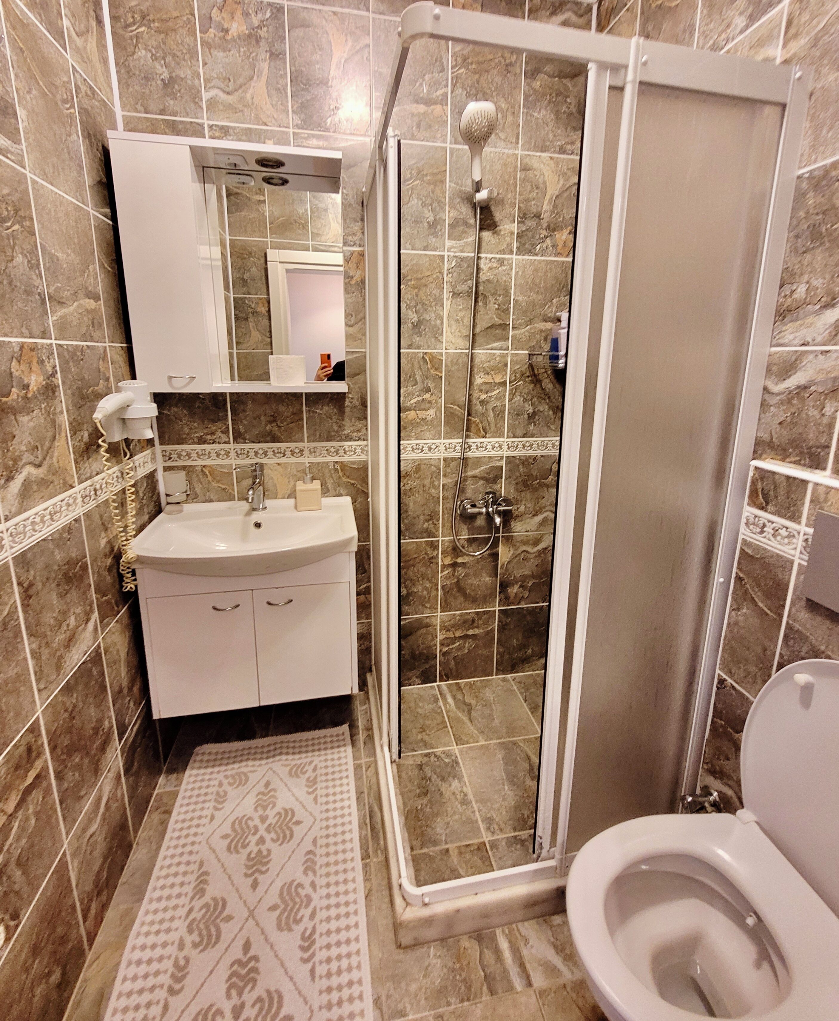 family room | bathroom | shower, hair dryer, slippers, towels