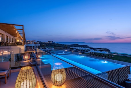 Seasonal outdoor pool, pool umbrellas, pool loungers. Aulus Chania All-Inclusive Resort, Curio Collection by Hilton - Adults Only
