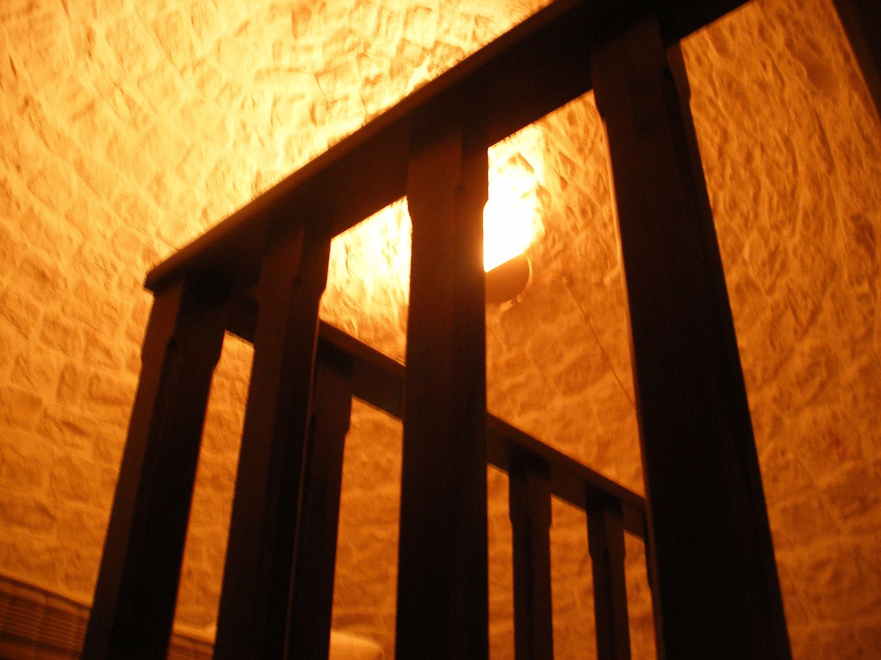 A ceiling with a textured pattern and a light fixture.