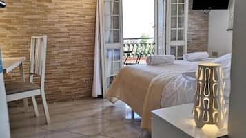 Deluxe Room, 1 Queen Bed, Private Bathroom, City View | 1 bedroom, hypo-allergenic bedding, down comforters