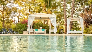 A pool area with a gazebo, lounge chairs, and a covered seating area. - Sa Vinya des Convent Agroturismo (Inca)