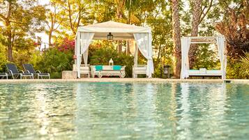 Outdoor pool, open 9:00 AM to 9:00 PM, pool umbrellas, sun loungers