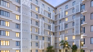 A hotel with a large outdoor swimming pool, multiple balconies, and a covered outdoor seating area. - The Alana Hotel & Conference Center Malioboro Yogyakarta by ASTON (Yogyakarta)