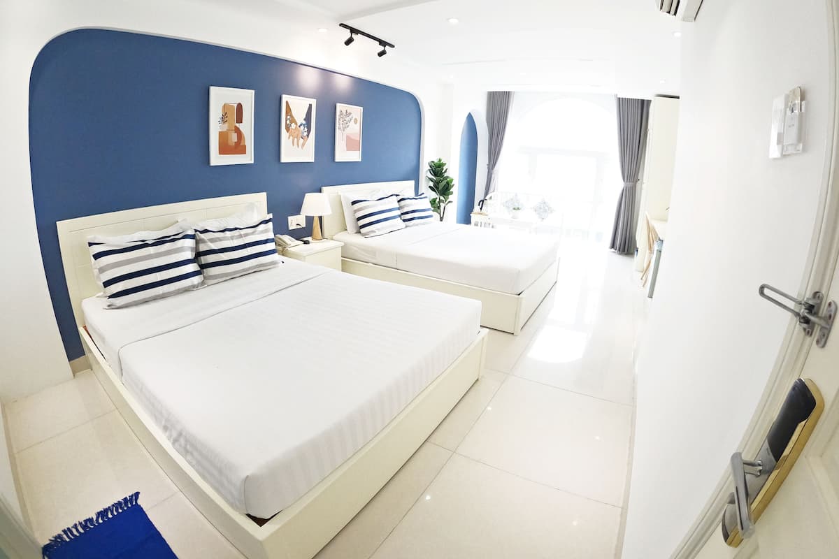 Family Suite, 2 Queen Beds | Minibar, in-room safe, desk, laptop workspace
