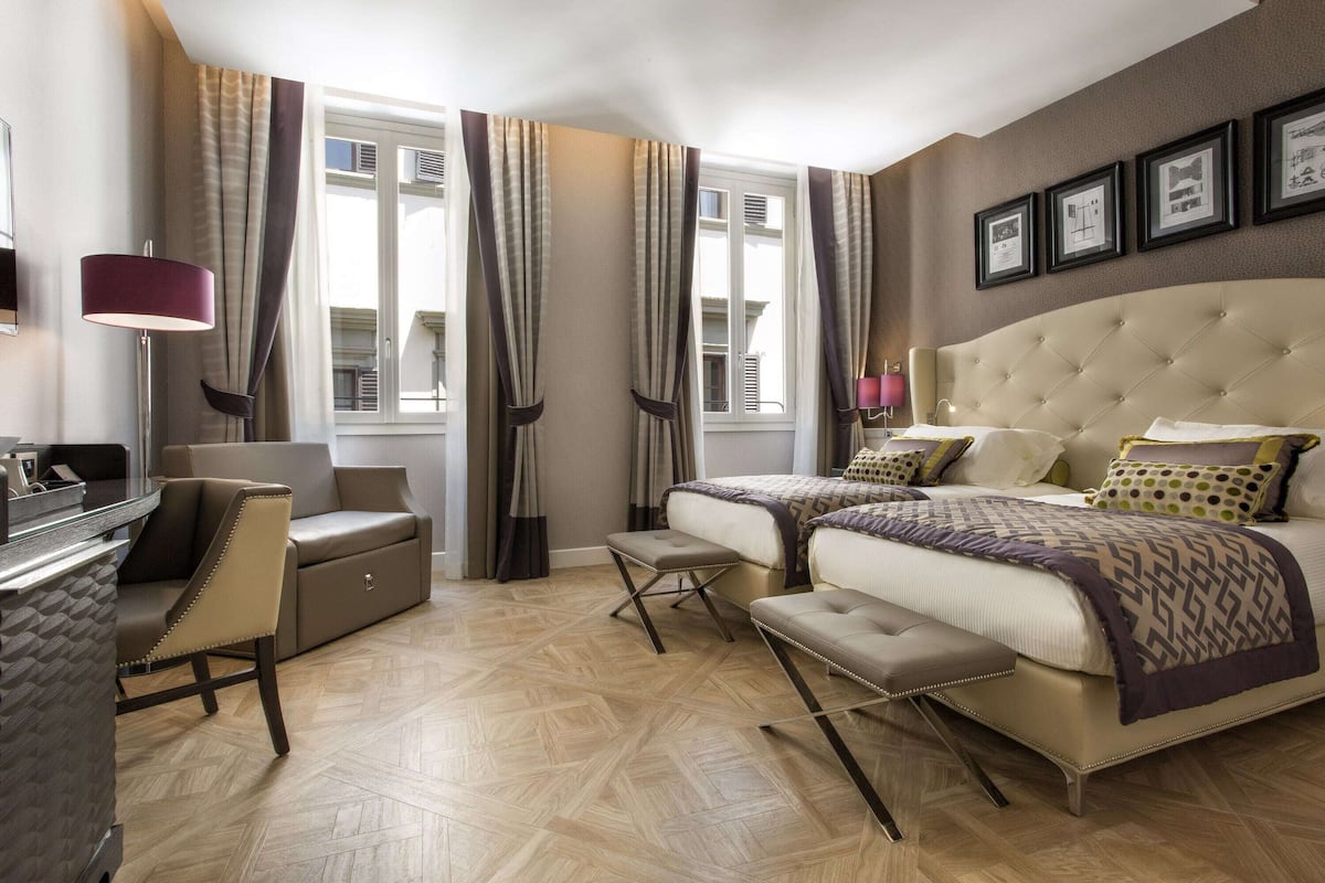 Premium bedding, memory-foam beds, free minibar, in-room safe
